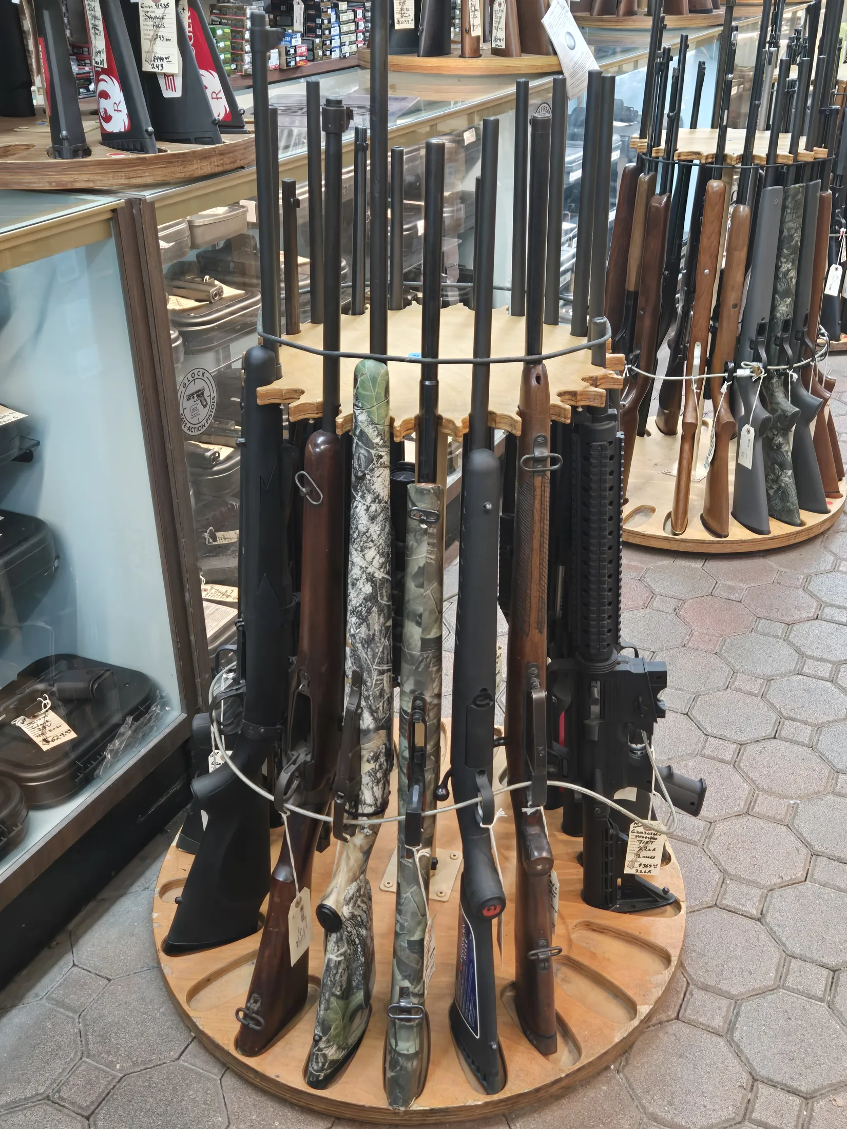 Rotating rack of shotguns and rifles at AAA Gun & Pawn