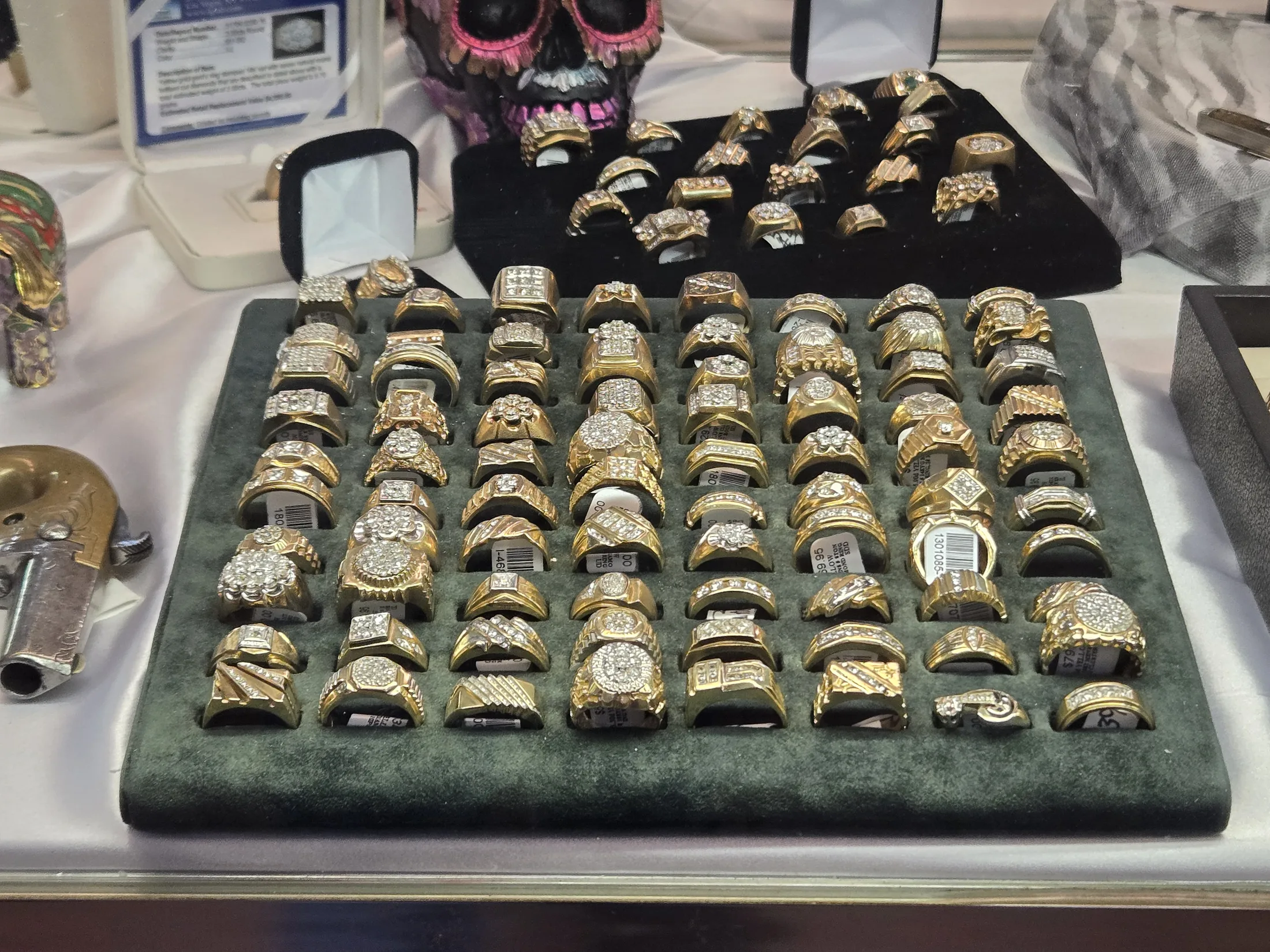 Tray of gold rings in the jewelry showcase at AAA Gun & Pawn