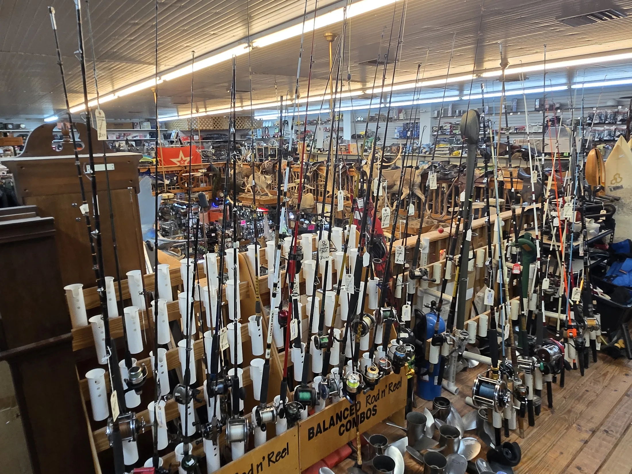 Racks of fishing rods and reels at AAA Gun & Pawn