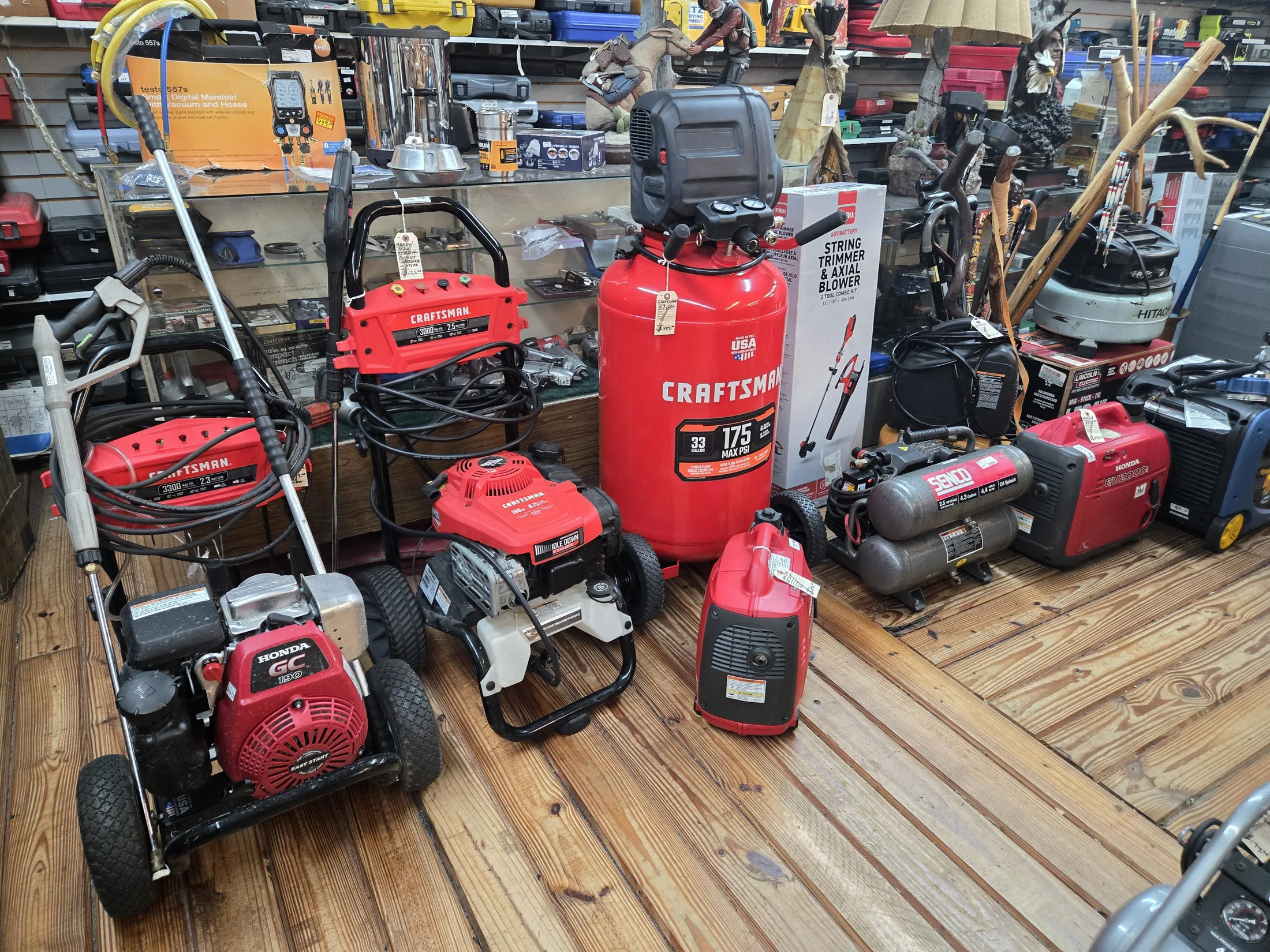 Pressure washers, air compressors and generators on the tool floor at AAA Gun & Pawn