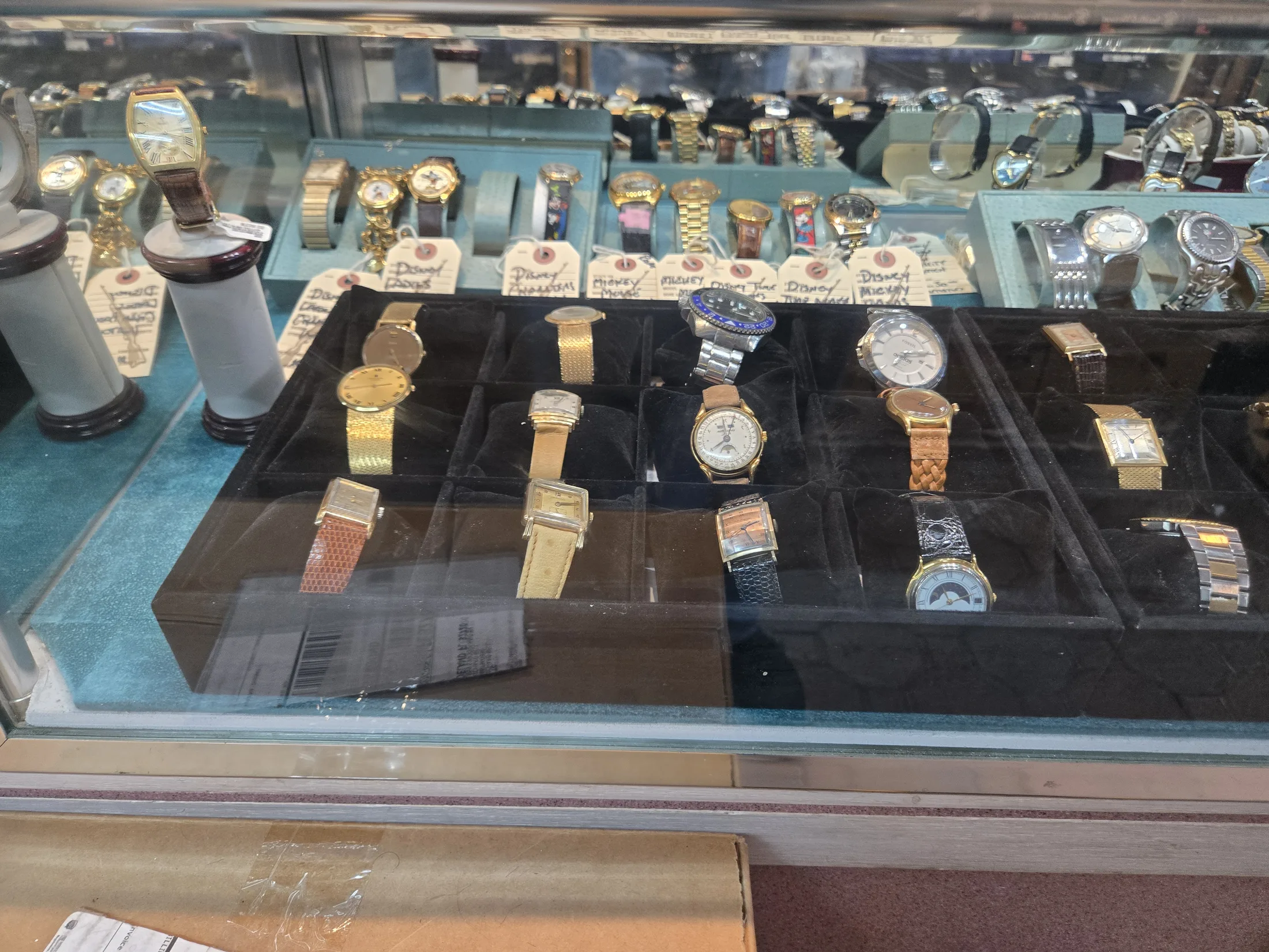 Wristwatches displayed in the jewelry showcase at AAA Gun & Pawn